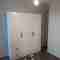 Customised furniture: white wardrobe with classic elements